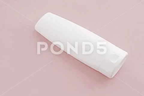 Moisturizing hand cream or body lotion on pink background, beauty product and Stock-Fotos