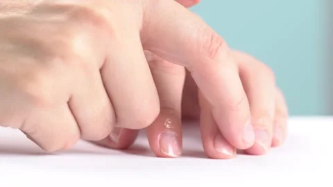 Moisturizing serum or oil for cuticles. The woman cares for hands and nails.. Stock Footage 277976649