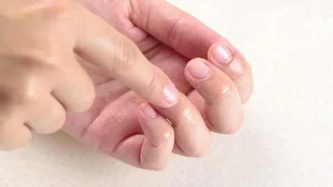 Moisturizing serum or oil for cuticles. The woman cares for hands and nails.. Stock Footage 284420743