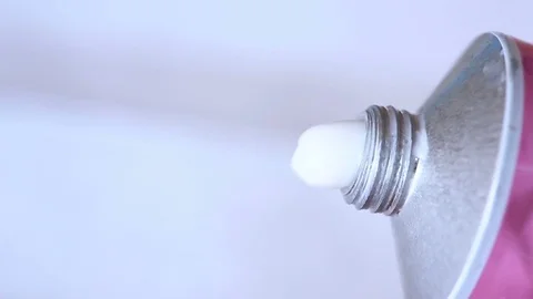 Moisturizing white cream squeezed out of a tube on a white background Stock Footage 75705237