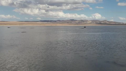 Mojave Desert Dry Lake Bed Transformed into a Vast Lake in California Stock Footage 264010933