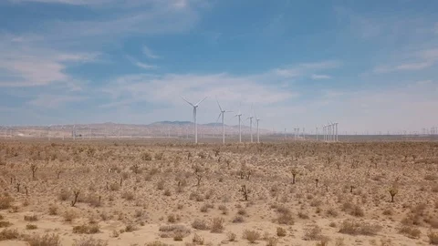 Mojave Desert Parallax, pull back from windmills in background Stock Footage 92762182