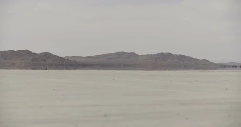 Mojave Dry Lake Bed Medium Wide Shot Mirage and Heat Waves Stock Footage 89941609