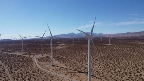 Mojave Wind Farm pan right across several large wind turbines DJI 4K 24fps Video stock 228878314