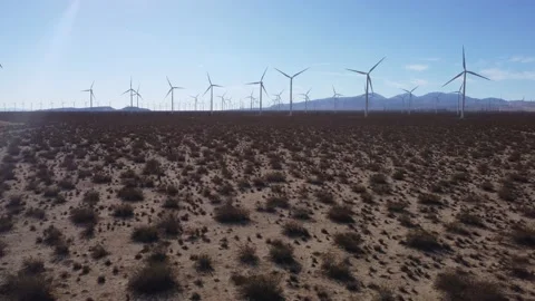 Mojave Wind &amp; Solar Farm low fly/pan from turbines to solar panels to DJI 4K Video stock 228881204
