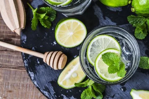 Mojito cocktail in a bur on a rustic table, selective focus Stock Photos
