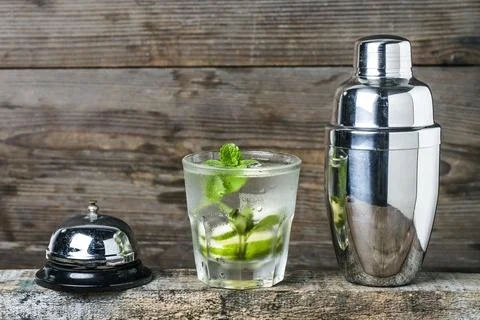 Mojito cocktail in a bur on a rustic table, selective focus Stock Photos