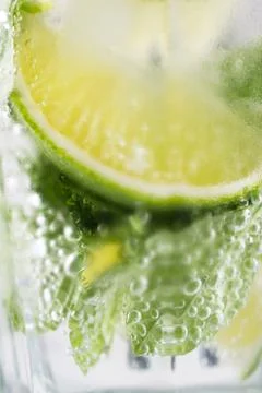 Mojito drink with lime, closeup . Macro concept of lemon , lime, mint  mojito Stock Photos