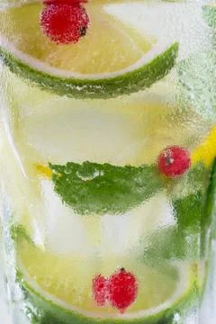 Mojito drink with lime, closeup . Macro concept of lemon , lime, mint  mojito Stock Photos