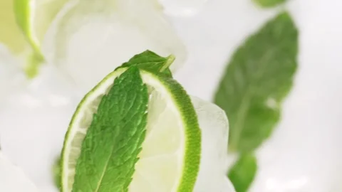 Mojito ingrediences flying up, lime, mint, ices and water. Drink concept Stock Footage 309124003