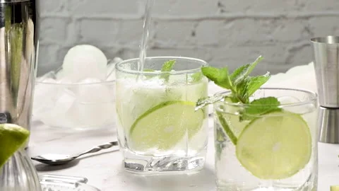 Mojito - a light aperitif in the hot summer season Stock Footage 247564445