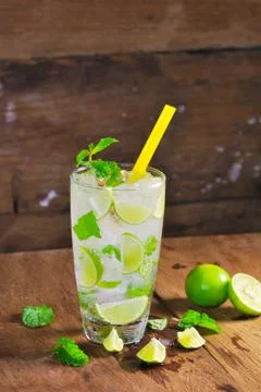Mojito , lime pieces , leaves of mint with ice and rum Stock Photos
