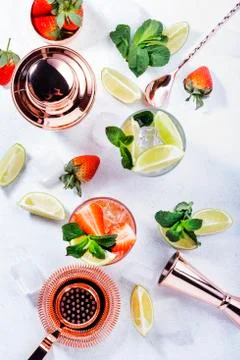 Mojito mocktail set with lime, mint, strawberry and ice on white background.  Stock Photos