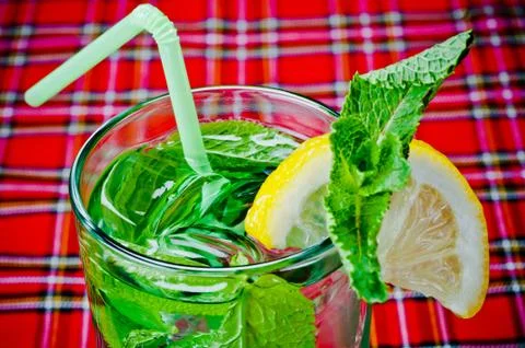 Mojito on a red background with ice 스톡 사진