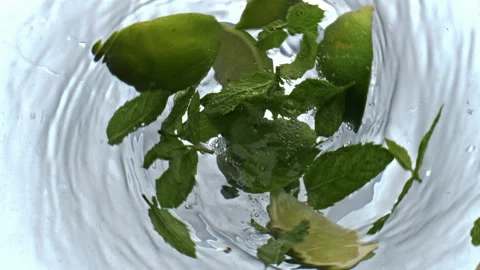 Mojito spinning inside glassware above view. Citrus mineral water tornado drink Stock Footage 219268534