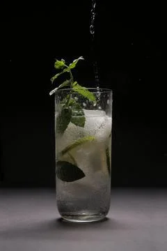 Mojito splash studio on black background Stock Photos