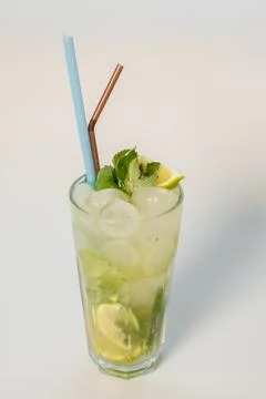 Mojito with straw on white background Stock Photos