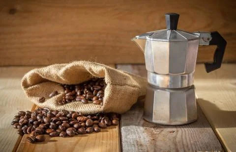 Moka coffee machine, coffee beans and burlap sack Stock Photos