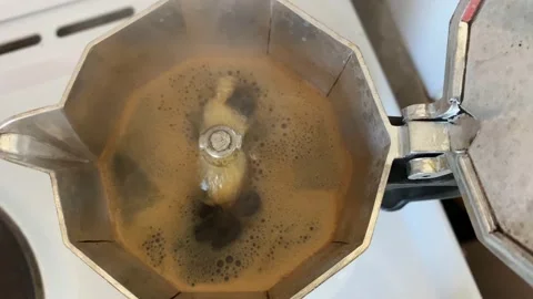 Moka pot with boiling coffee, process of making coffee, close-up shot Stock Footage 131284801