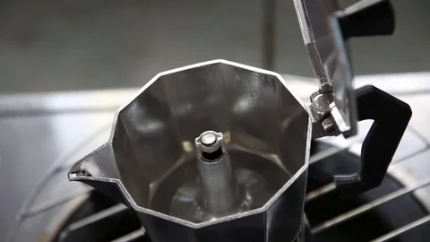 Moka Pot coffee maker on a hot stove. Stock Footage 75231206