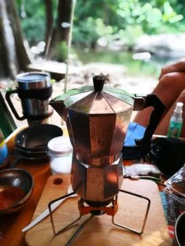 Mokka pot for morning coffee in camping life Stock Photos