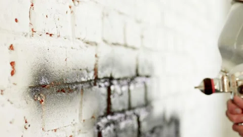 Molar Worker Processes Solution Sprays Impregnation Paint On Wall In Apartment Video stock 195542327