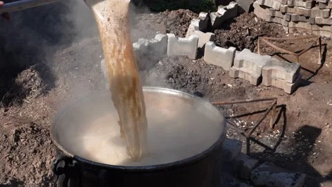 Molasses is made by boiling grapes at high temperatures in cauldrons. Stock Footage 166018368