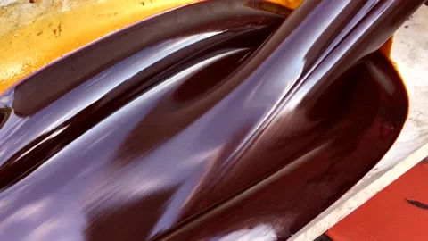 Molasses poured into tank Stock Footage 134850740