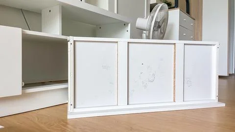 Mold on the back wall of a white cabinet after exposure to moisture in a residen Stock Photos