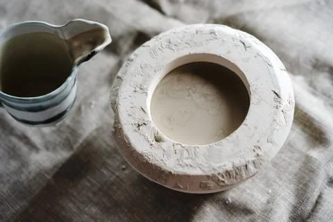 Mold for casting clay products with a mixture inside. Photos