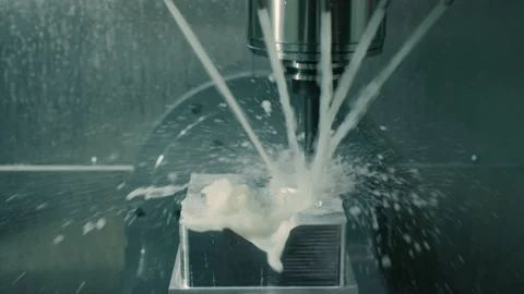 Mold machine drills and sprays water on mold as it's made in manufacturing plant Stock Footage 146922863