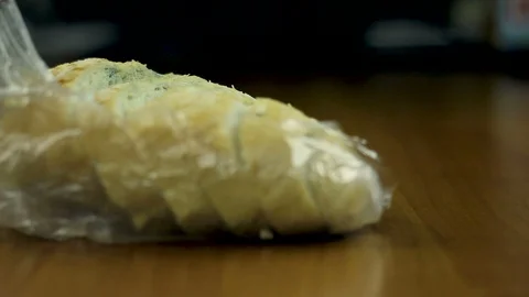 Molded bread on the kitchen table Video stock 104624119