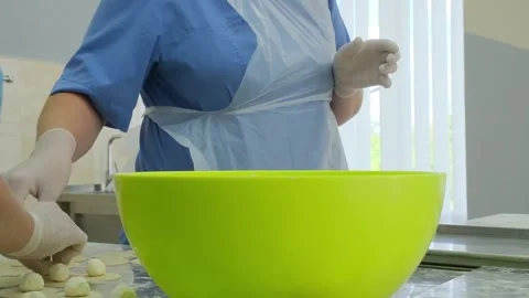 Molding of dumplings in the production workshop Stock Footage 166946803