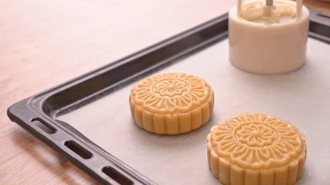 Molding shape of moon cake pastry on baking tray with beautiful pattern Stock Footage 113962233