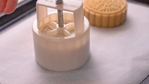 Molding shape of moon cake pastry on baking tray with beautiful pattern Stock Footage 113962486