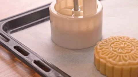 Molding shape of moon cake pastry on baking tray with beautiful pattern Stock Footage 113962492