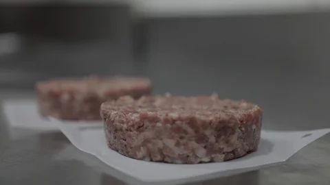 Molding Two Tall Raw Meat Burger Stock Footage 129044927