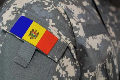 Moldova army uniform patch flag on soldiers arm. Military Concept Stock Illustration