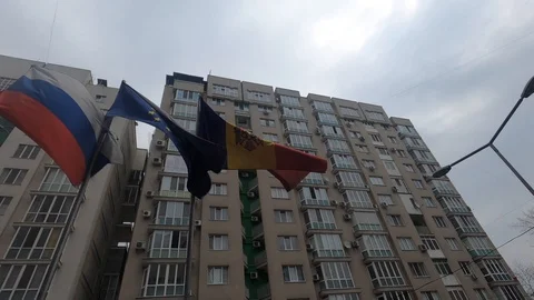 Moldovan flag and building behind Stock Footage 127830767