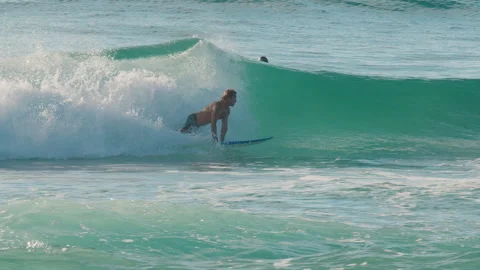 MOLE BEACH, FLORIANOPOLIS, BRAZIL - 25 FEBRUARY 2026: Surfer with limited Video stock 330198535