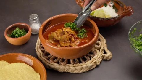 Mole de panza, adding chopped cilantro, mexican gastronomy Stock Footage 279206825