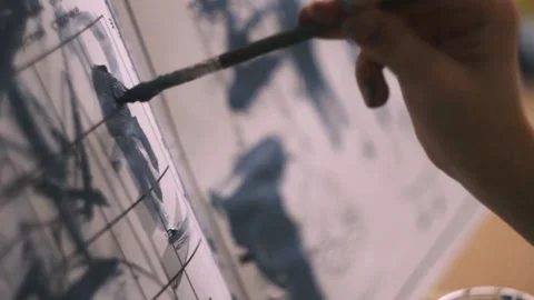 Mole draws with a brush on the easel Stock Footage 132665271