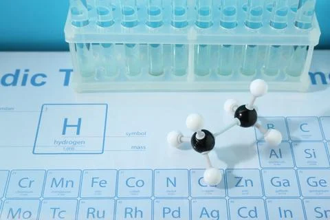 Molecular model and test tubes on periodic table Stock Photos