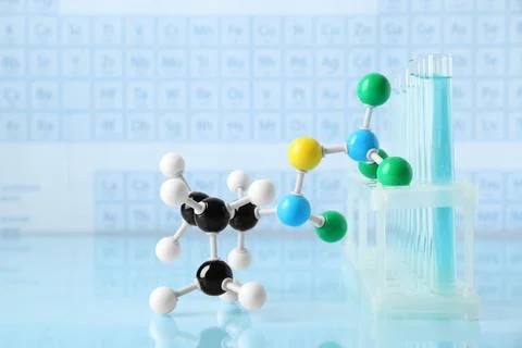 Molecular model and test tubes on light surface 写真素材