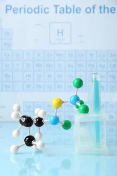Molecular model and test tubes on light surface 写真素材