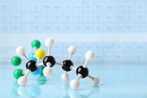 Molecular model on light surface against blurred background, space for text Foto stock