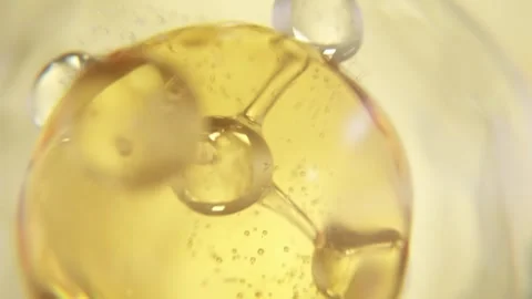 Molecule and Golden liquid bubble | Hair Oil Molecule animation in HQ Stock Footage 306935310