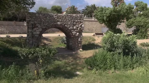 Molí de Mar arch beach coast Europe gate Medieval Mediterranean pan sea stone Stock Footage 317318982
