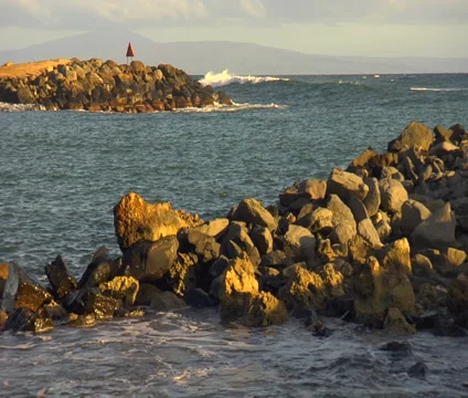 Molokai ocean, WS small waves rolling on white and black rocks Stock Footage 5848220