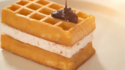 Molten dark chocolate on waffle Stock Footage 72821865